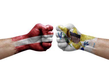 Two hands punch to each others on white background. Country flags painted fists, conflict crisis concept between latvia and virgin islands