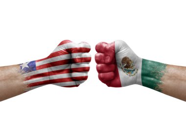 Two hands punch to each others on white background. Country flags painted fists, conflict crisis concept between liberia and mexico