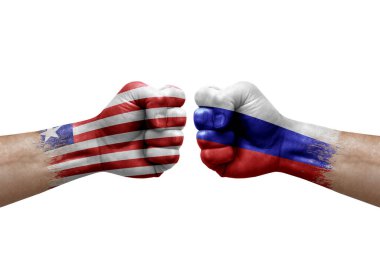 Two hands punch to each others on white background. Country flags painted fists, conflict crisis concept between liberia and russia