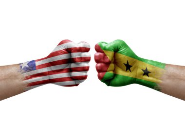 Two hands punch to each others on white background. Country flags painted fists, conflict crisis concept between liberia and sao tome and principe