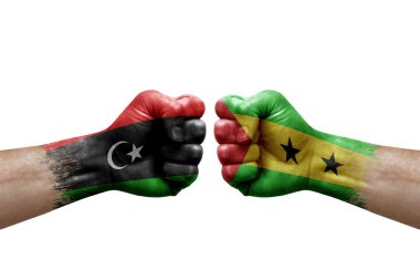 Two hands punch to each others on white background. Country flags painted fists, conflict crisis concept between libya and sao tome and principe
