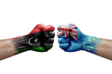 Two hands punch to each others on white background. Country flags painted fists, conflict crisis concept between libya and tuvalu