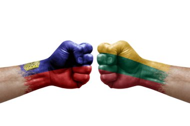Two hands punch to each others on white background. Country flags painted fists, conflict crisis concept between liechtenstein and lithuania
