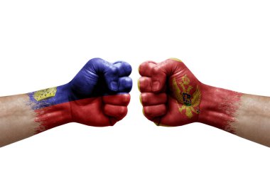 Two hands punch to each others on white background. Country flags painted fists, conflict crisis concept between liechtenstein and montenegro