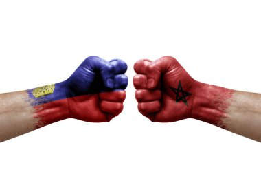 Two hands punch to each others on white background. Country flags painted fists, conflict crisis concept between liechtenstein and morocco