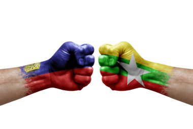 Two hands punch to each others on white background. Country flags painted fists, conflict crisis concept between liechtenstein and myanmar