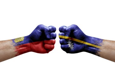 Two hands punch to each others on white background. Country flags painted fists, conflict crisis concept between liechtenstein and nauru