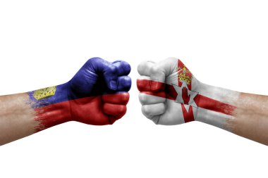 Two hands punch to each others on white background. Country flags painted fists, conflict crisis concept between liechtenstein and ireland