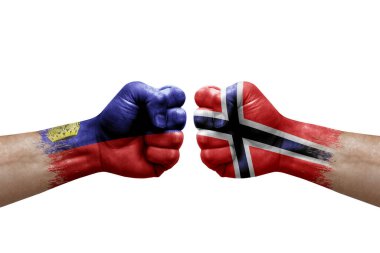 Two hands punch to each others on white background. Country flags painted fists, conflict crisis concept between liechtenstein and norway