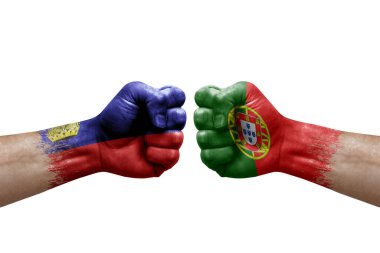 Two hands punch to each others on white background. Country flags painted fists, conflict crisis concept between liechtenstein and portugal