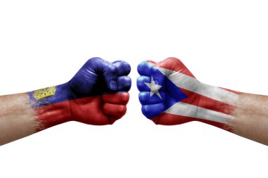 Two hands punch to each others on white background. Country flags painted fists, conflict crisis concept between liechtenstein and puerto rico