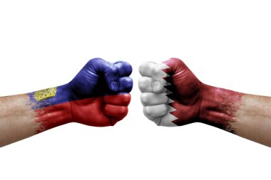 Two hands punch to each others on white background. Country flags painted fists, conflict crisis concept between liechtenstein and qatar
