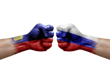 Two hands punch to each others on white background. Country flags painted fists, conflict crisis concept between liechtenstein and russia