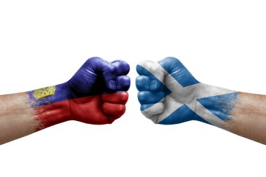 Two hands punch to each others on white background. Country flags painted fists, conflict crisis concept between liechtenstein and scotland