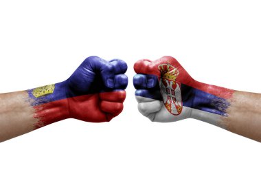 Two hands punch to each others on white background. Country flags painted fists, conflict crisis concept between liechtenstein and serbia