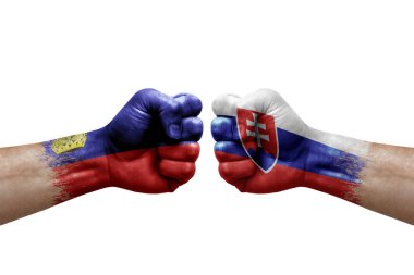 Two hands punch to each others on white background. Country flags painted fists, conflict crisis concept between liechtenstein and slovakia