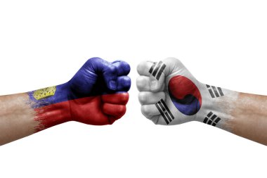 Two hands punch to each others on white background. Country flags painted fists, conflict crisis concept between liechtenstein and south korea