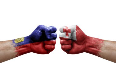 Two hands punch to each others on white background. Country flags painted fists, conflict crisis concept between liechtenstein and tonga