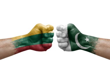 Two hands punch to each others on white background. Country flags painted fists, conflict crisis concept between lithuania and pakistan