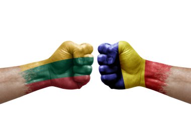 Two hands punch to each others on white background. Country flags painted fists, conflict crisis concept between lithuania and romania