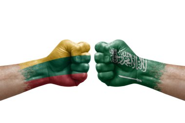 Two hands punch to each others on white background. Country flags painted fists, conflict crisis concept between lithuania and saudi arabia