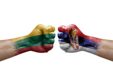 Two hands punch to each others on white background. Country flags painted fists, conflict crisis concept between lithuania and serbia