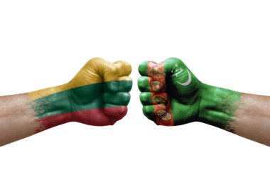 Two hands punch to each others on white background. Country flags painted fists, conflict crisis concept between lithuania and turkmenistan