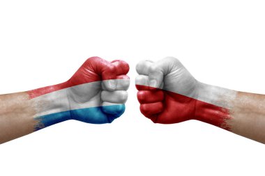 Two hands punch to each others on white background. Country flags painted fists, conflict crisis concept between luxembourg and poland