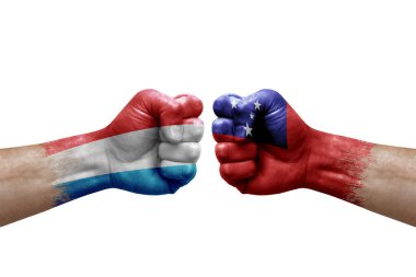 Two hands punch to each others on white background. Country flags painted fists, conflict crisis concept between luxembourg and samoa