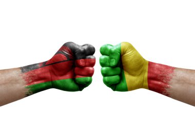 Two hands punch to each others on white background. Country flags painted fists, conflict crisis concept between malawi and mali