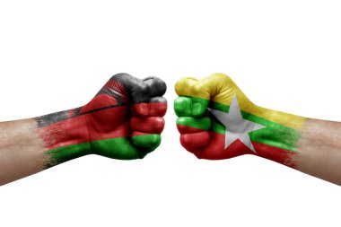 Two hands punch to each others on white background. Country flags painted fists, conflict crisis concept between malawi and myanmar