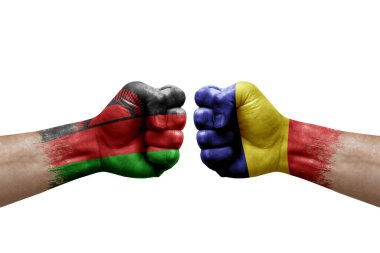 Two hands punch to each others on white background. Country flags painted fists, conflict crisis concept between malawi and romania