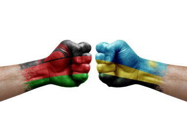 Two hands punch to each others on white background. Country flags painted fists, conflict crisis concept between malawi and rwanda