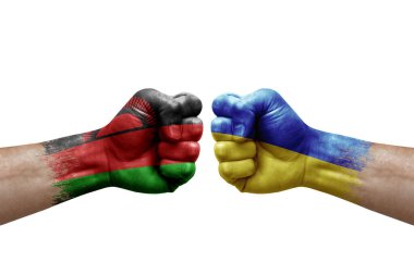 Two hands punch to each others on white background. Country flags painted fists, conflict crisis concept between malawi and ukraine