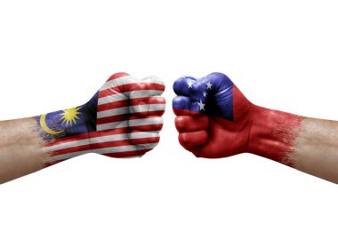 Two hands punch to each others on white background. Country flags painted fists, conflict crisis concept between malaysia and samoa
