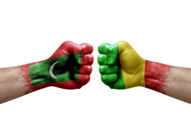 Two hands punch to each others on white background. Country flags painted fists, conflict crisis concept between maldives and mali