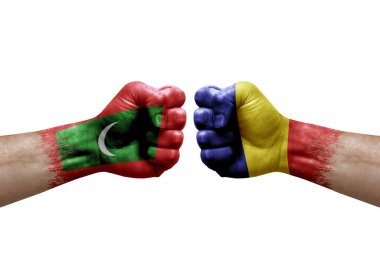Two hands punch to each others on white background. Country flags painted fists, conflict crisis concept between maldives and romania
