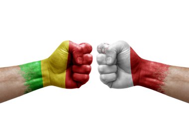 Two hands punch to each others on white background. Country flags painted fists, conflict crisis concept between mali and malta