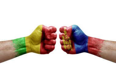 Two hands punch to each others on white background. Country flags painted fists, conflict crisis concept between mali and mongolia