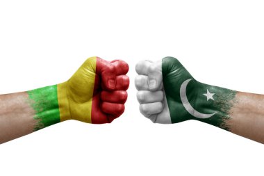 Two hands punch to each others on white background. Country flags painted fists, conflict crisis concept between mali and pakistan
