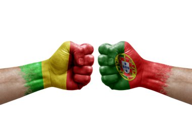 Two hands punch to each others on white background. Country flags painted fists, conflict crisis concept between mali and portugal