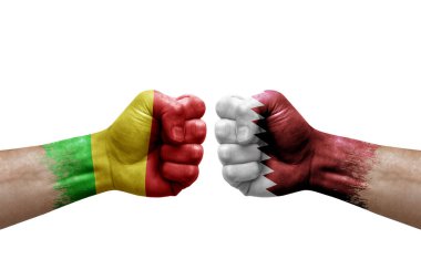 Two hands punch to each others on white background. Country flags painted fists, conflict crisis concept between mali and qatar