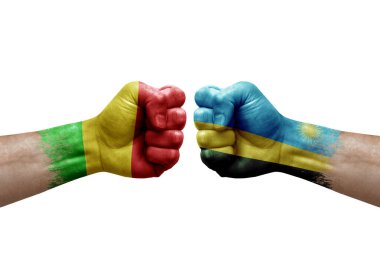 Two hands punch to each others on white background. Country flags painted fists, conflict crisis concept between mali and rwanda