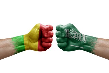Two hands punch to each others on white background. Country flags painted fists, conflict crisis concept between mali and saudi arabia