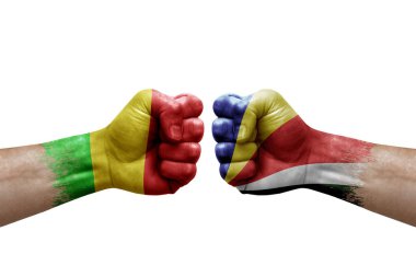 Two hands punch to each others on white background. Country flags painted fists, conflict crisis concept between mali and seychelles