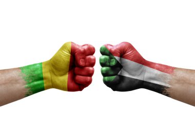 Two hands punch to each others on white background. Country flags painted fists, conflict crisis concept between mali and sudan