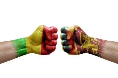 Two hands punch to each others on white background. Country flags painted fists, conflict crisis concept between mali and sri lanka