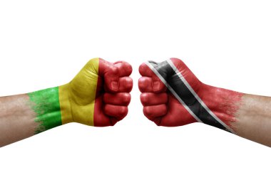 Two hands punch to each others on white background. Country flags painted fists, conflict crisis concept between mali and tobago