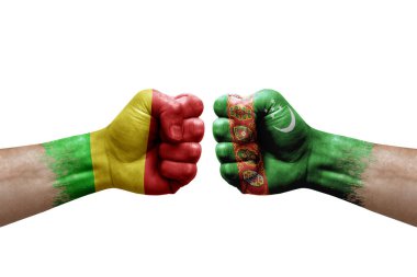 Two hands punch to each others on white background. Country flags painted fists, conflict crisis concept between mali and turkmenistan