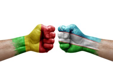 Two hands punch to each others on white background. Country flags painted fists, conflict crisis concept between mali and uzbekistan